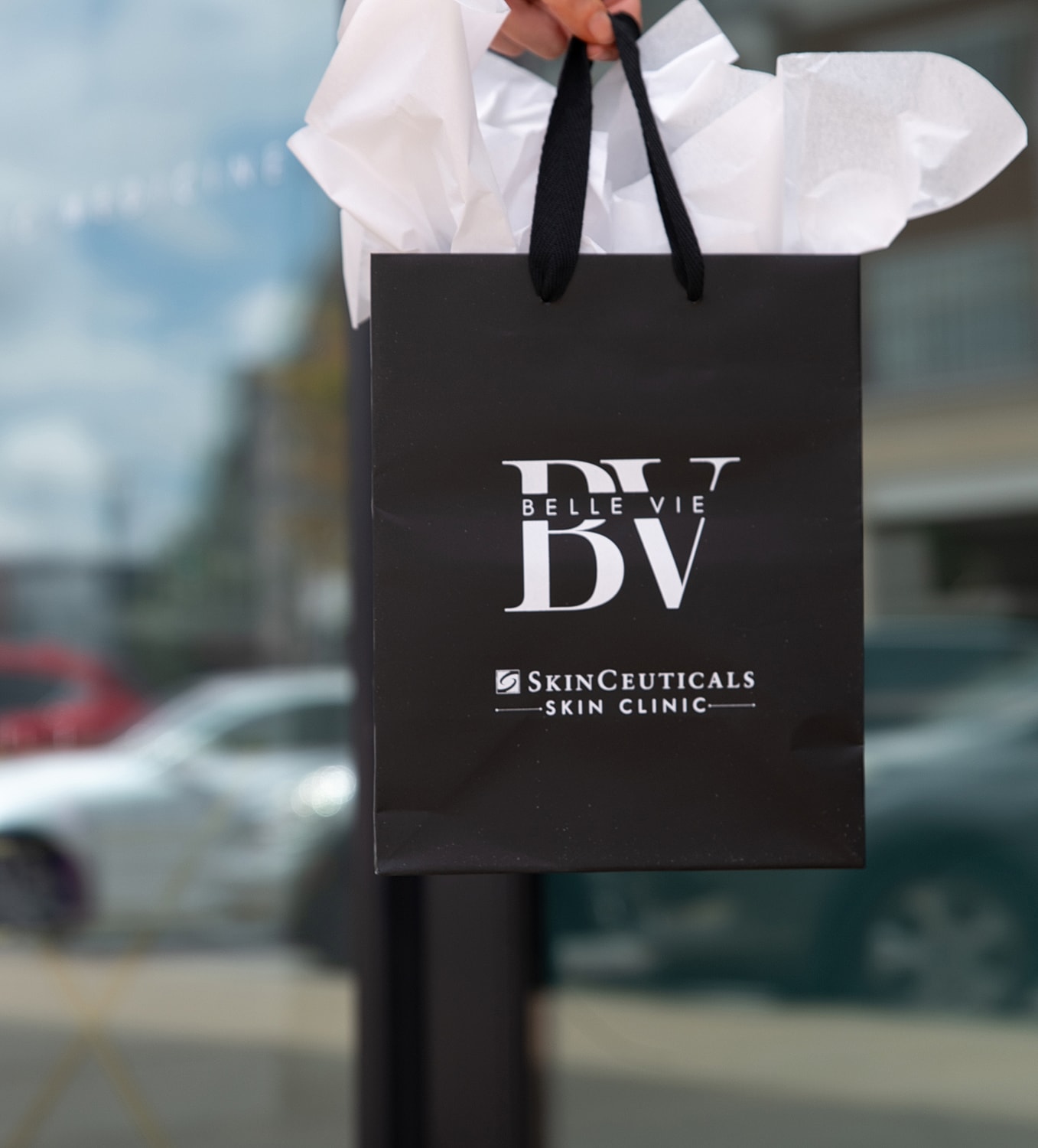 Black shopping bag from SkinCeuticals clinic.